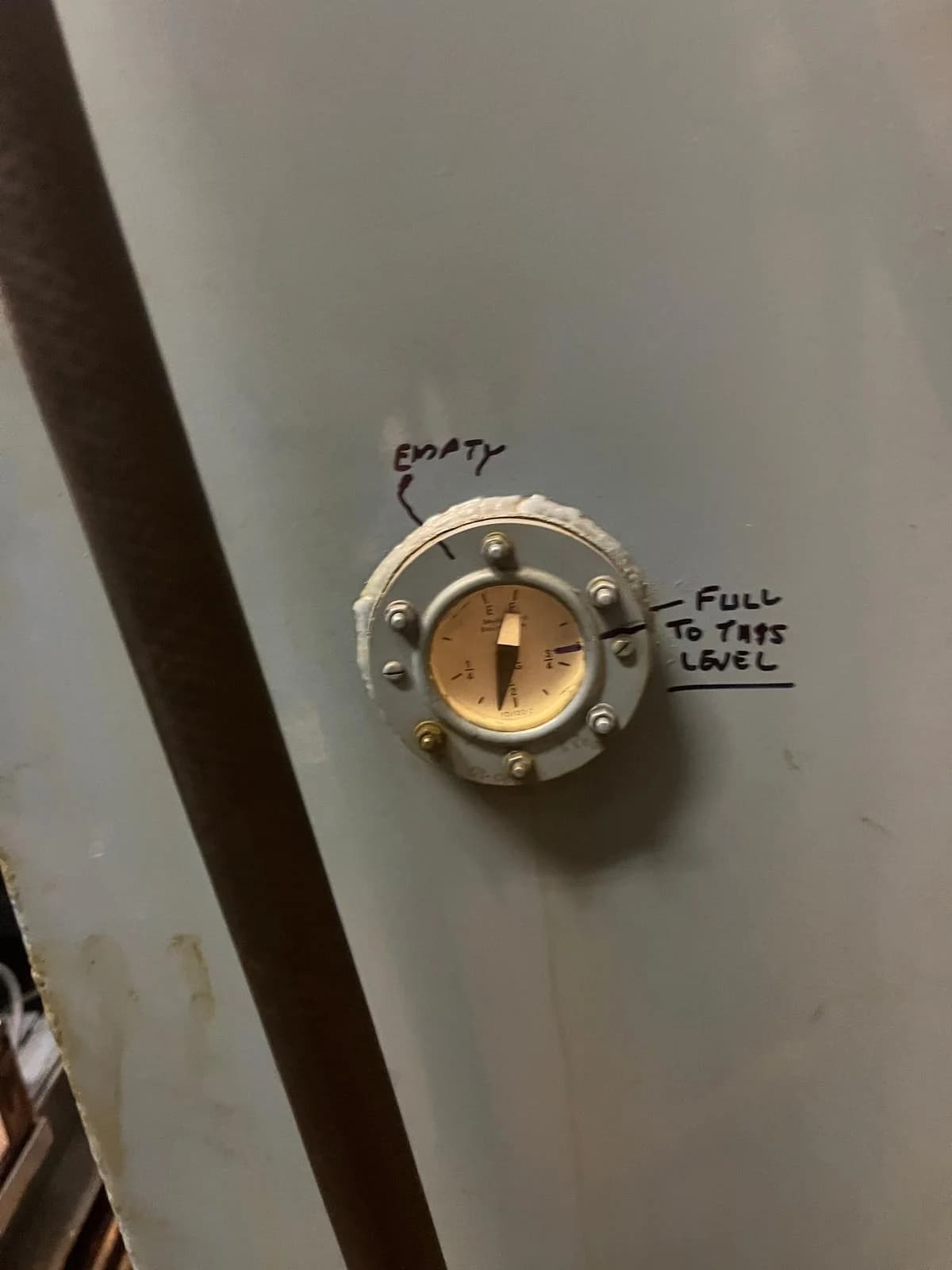 Boiler information plate checked during plumbing assessment