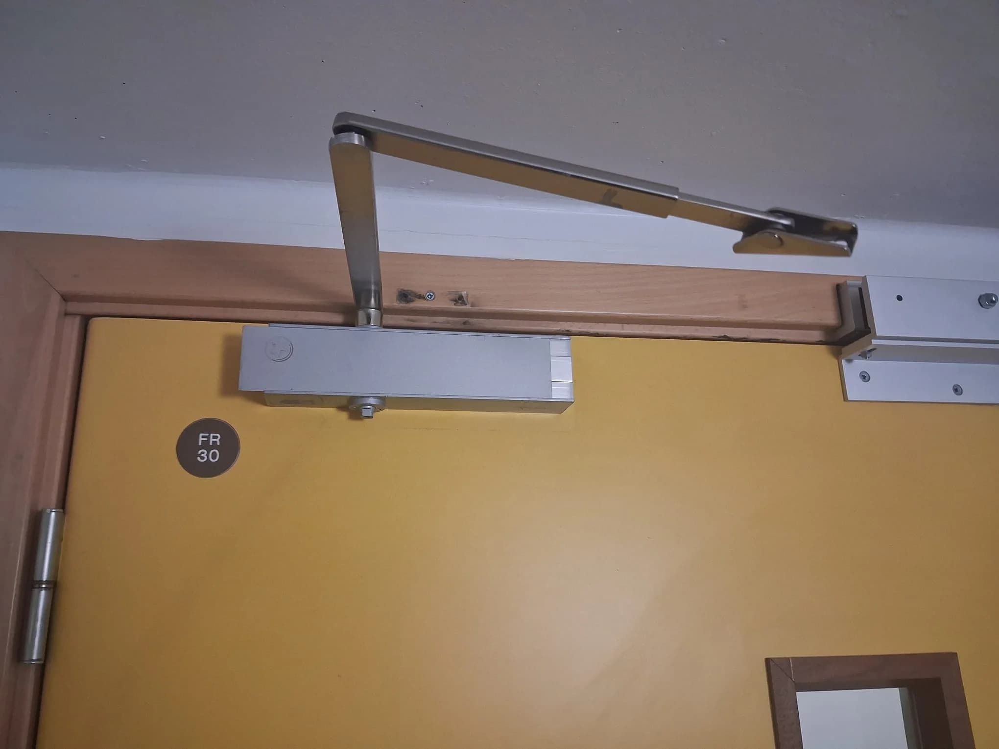 Door before adjustment and ironmongery repair