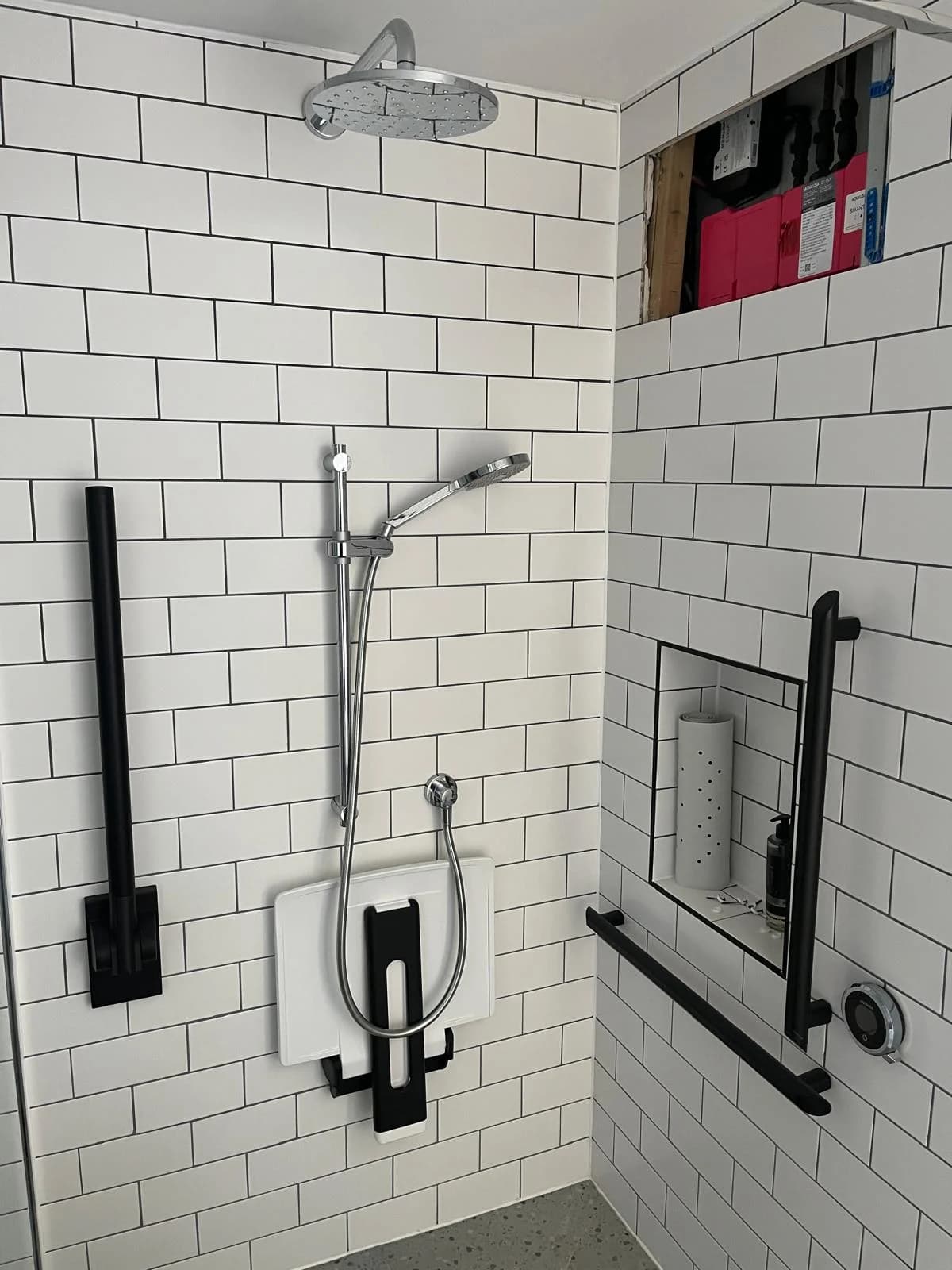 Finished shower area after plumbing repair