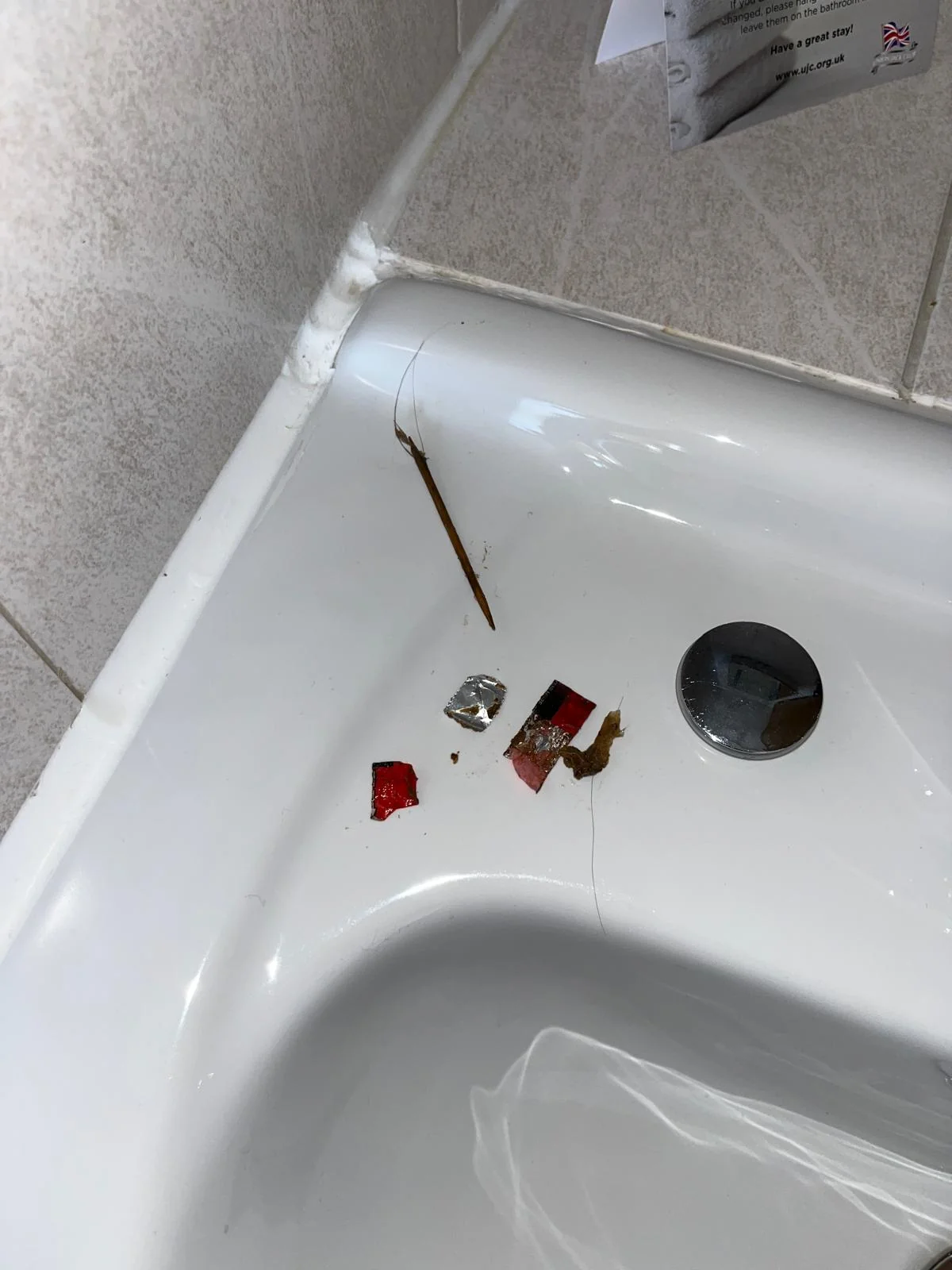 Basin waste components removed for inspection during blockage repair