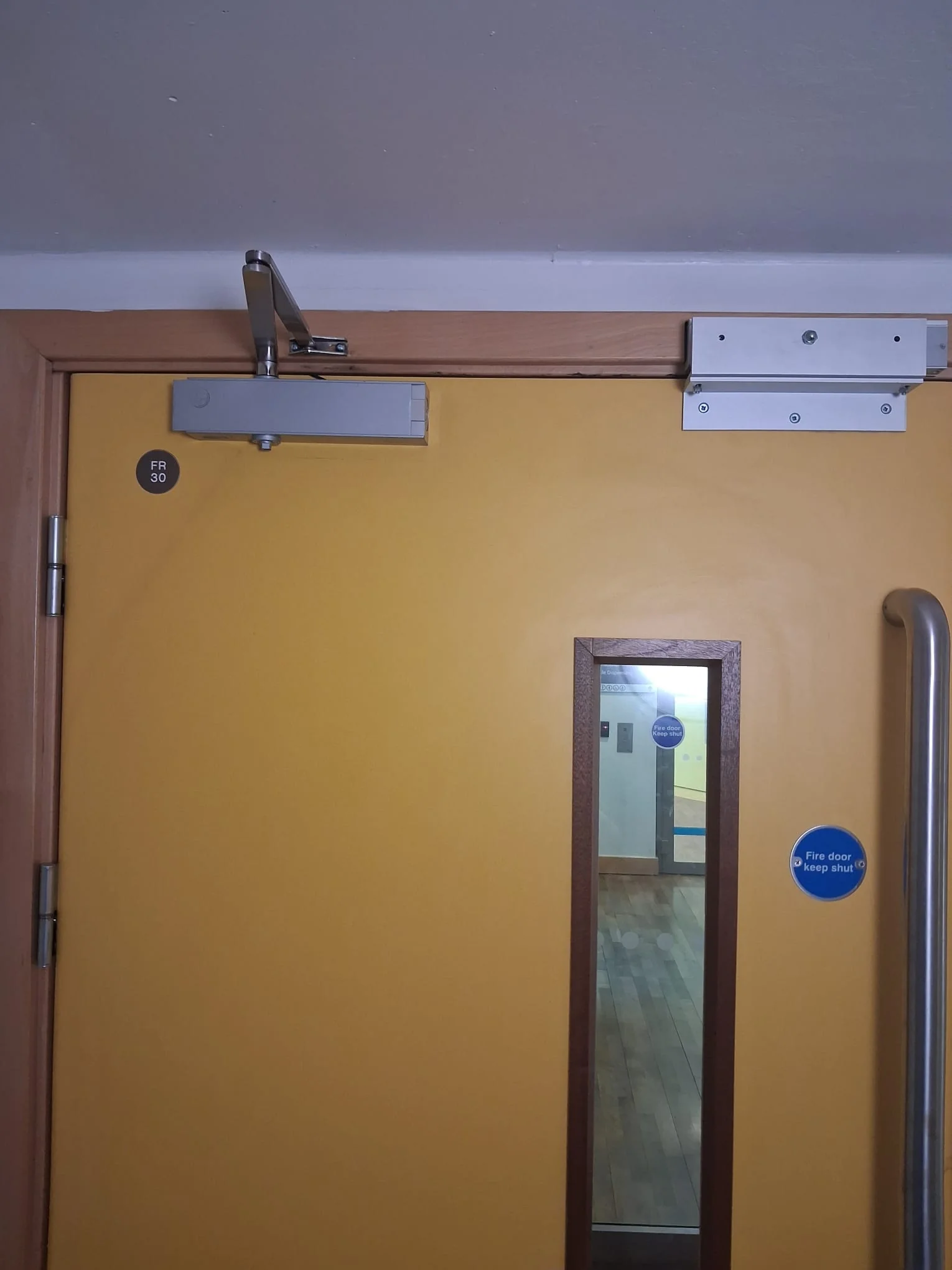 Internal door and closer after adjustment and repair
