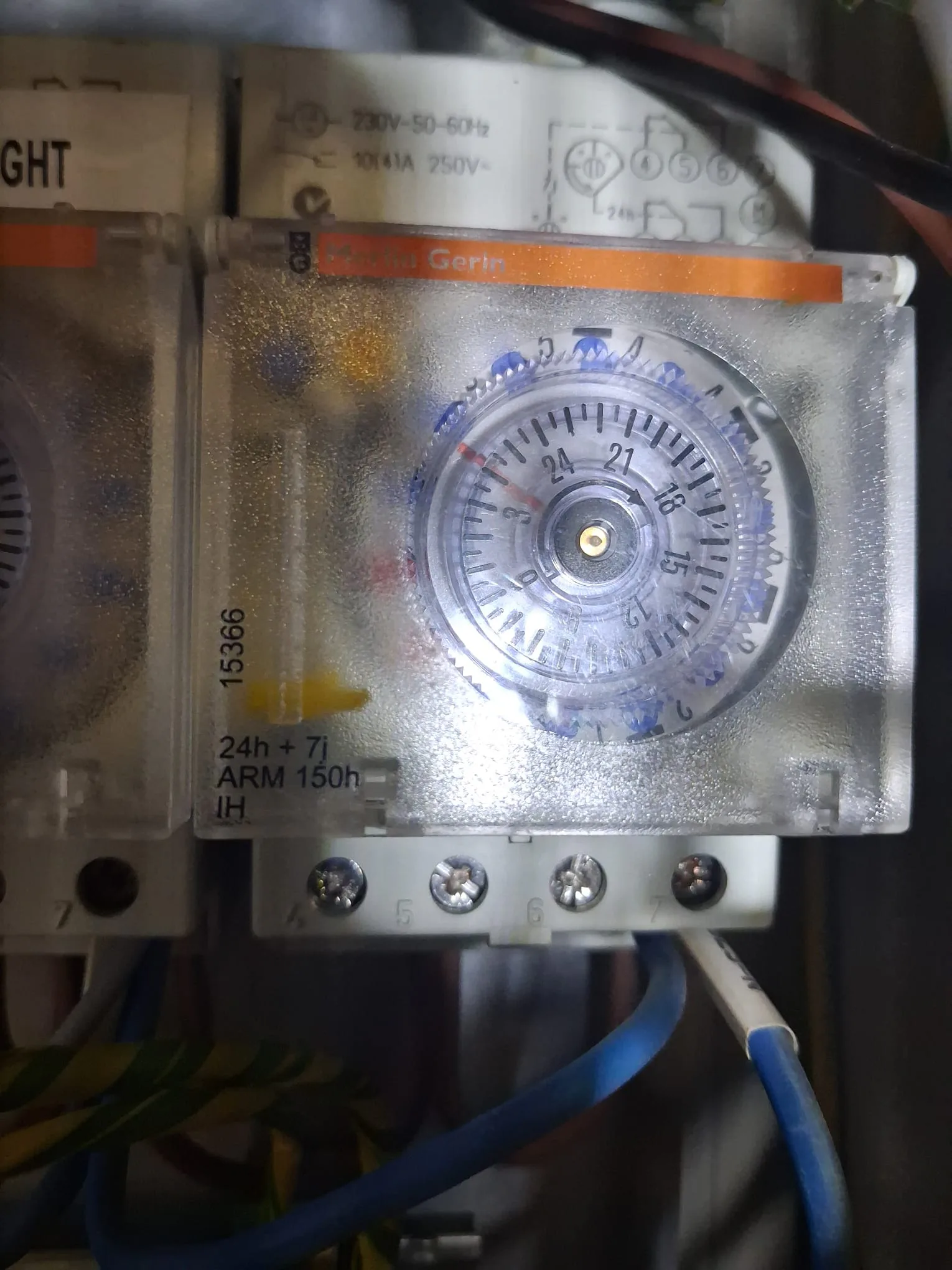 Replacement 24-hour and 7-day mechanical time switch installed in electrical control panel