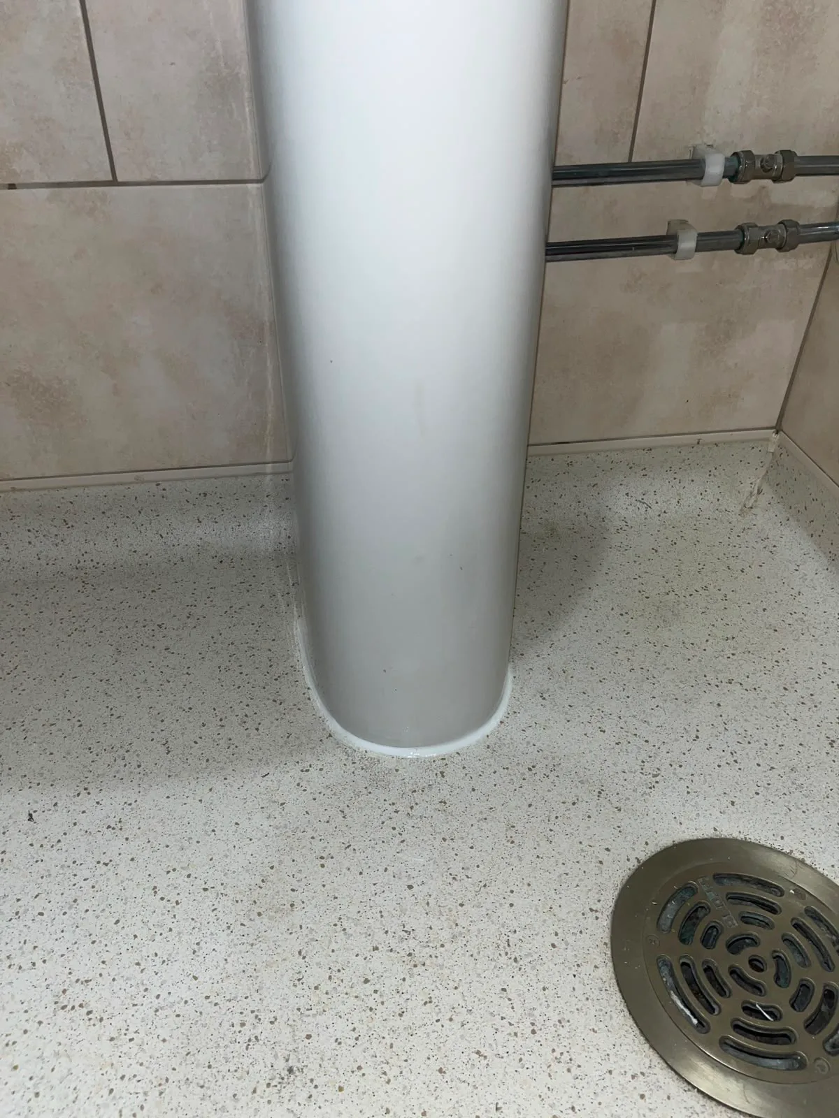 Basin pedestal resealed after plumbing repair in Bexleyheath